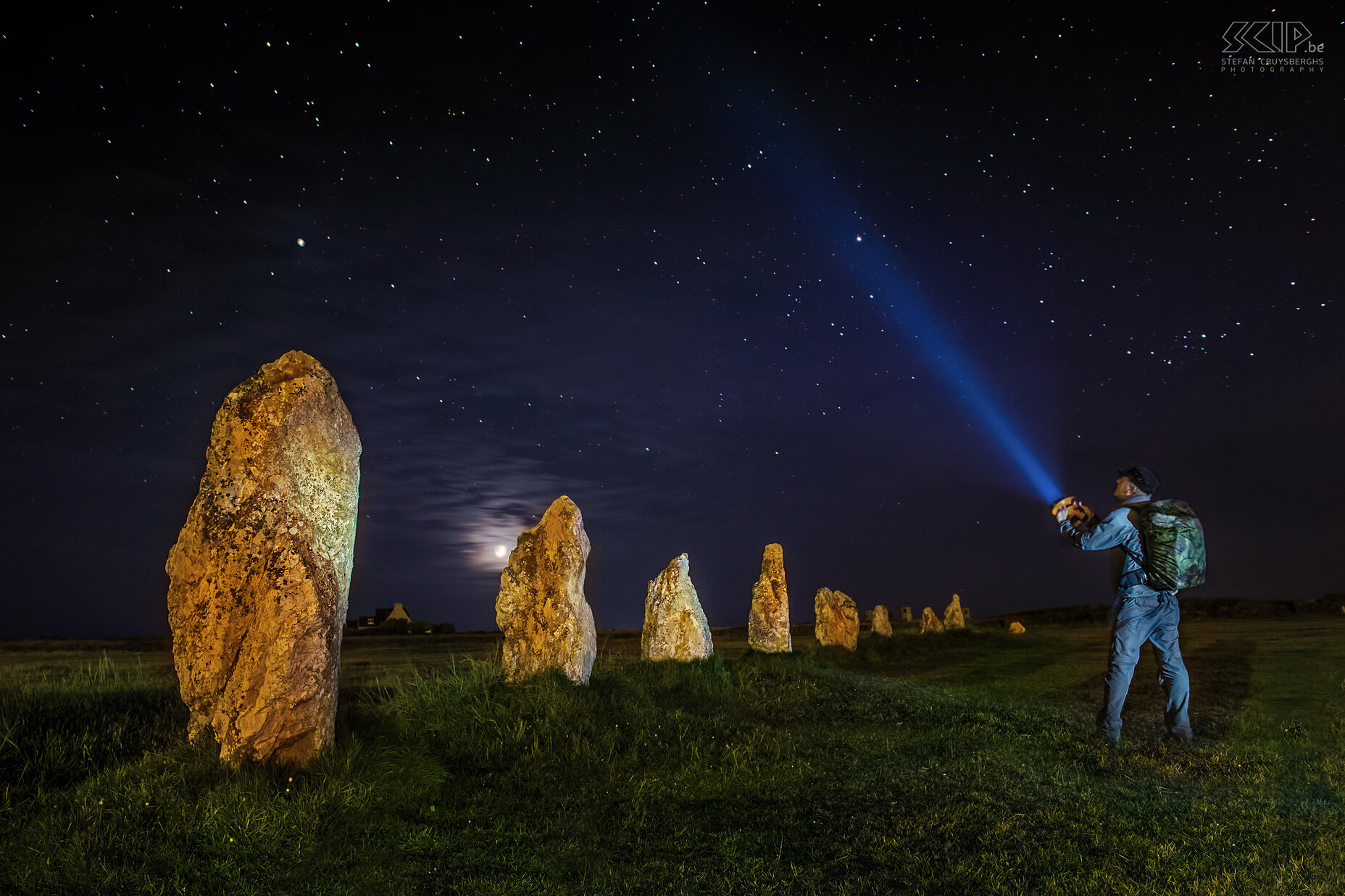 Crozon - Menhirs Lagatjar - Stefan The prehistoric menhirs from Lagatjar are an intriguing arrangement of hundreds of large prehistoric white quartz stones in an open field near the ocean. I used light painting techniques to create some night shots of the megaliths and at the end I was experimenting by adding myself with my torchlight towards the sky. When opening the RAW file at home I noticed that my camera had recorded so many colorful stars. Stefan Cruysberghs